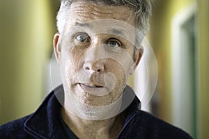 Closeup of middle aged man looking into the lens