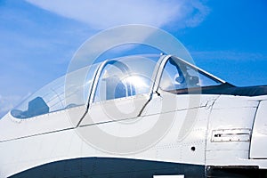 Closeup of military fighter jet cockpit and canopy against a blue sky,aircraft canopy against