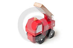 Miniature toy, wooden fire truck on white background