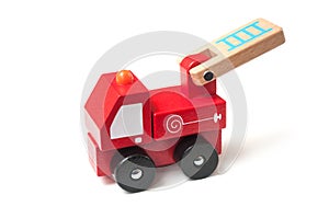 Miniature toy, wooden fire truck on white background