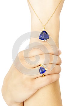 Closeup of a Model Wearing a Tanzanite Designer Ring and Pendant