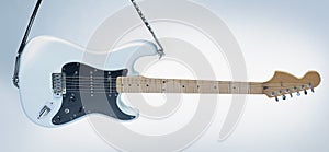 Closeup .modern electric guitar on a white background.