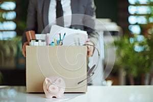 Closeup on modern female employee in modern green office