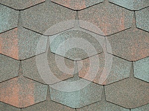 Closeup of modern heaxgon roof shingles tiles. waterproof scabrous rough surface for house exterior cover