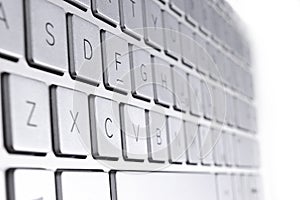 Closeup of a modern silver laptop computer keyboard. Laptop keyboard. Detail of the new and ergonomic computer keyboard