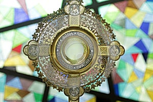 Closeup of Ostensory for worship at a Catholic church ceremony - Adoration to the Blessed Sacrament - Catholic Church Eucharistic.