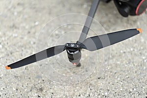 Closeup of motor and propeller of drone quadcopter for taking video and pictures. Preflight checking of before takeoff