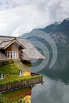 closeup mountain lake wooden hut house background