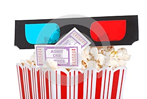 Closeup movie tickets popcorn and 3D glasses