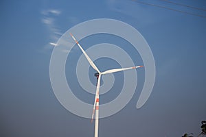 closeup of moving wind turbine against sky
