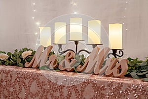 Closeup of a Mr & Mrs sign on a table at a wedding