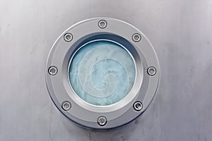 Closeup of muffle furnace equipment in pharma or chemical manufacturing plant or industry. Pill maker porthole window