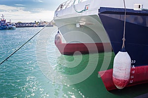 Closeup of multi-hulls of catamaran docked at Robben Island