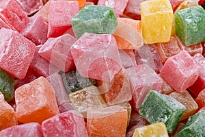 Closeup of multicolored cubes Turkish delight (Lokum). Selective Focus. Flat lay