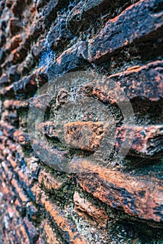 Closeup of multiple centuries old wall with dirty weathered surface