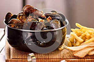 Closeup mussels in saucepan.