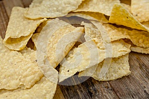 Closeup of Nacho Tortilla Chips on a rustic wooden table