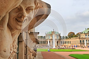 Closeup naked satyr smiling statue crop with fountain and garden