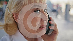 Closeup nervous pensioner calling smartphone expressing negative emotions.