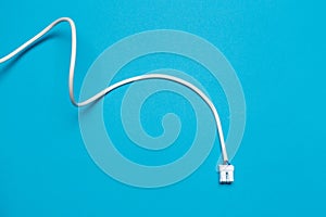 Closeup of network ethernet cable on blue background with space for text
