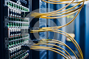Closeup networking cable in server room, fiber optic cables