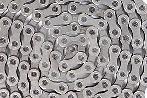 Closeup Of New Clean Oiled Twisted Circled Bicycle Chain Image Texture Isolated Over White