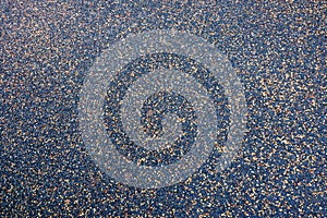 A closeup of new speckled tarmac path.