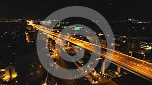 Closeup night traffic highway with driving cars, trucks aerial. Philippines Manila town cityscape