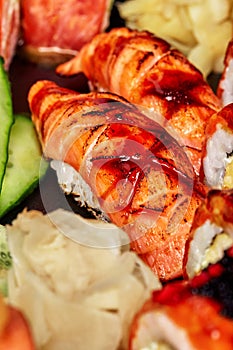 Closeup of nigirizushi with seared salmon and unagi sauce served in sushi set photo