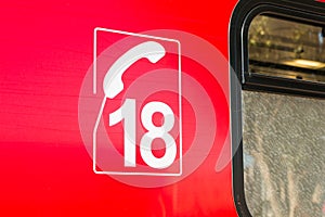 Closeup on the number of the phone of firefighters on ambulance