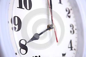 Closeup odern wall clock white, time and period, office timepiece and mockup with hour and minute photo