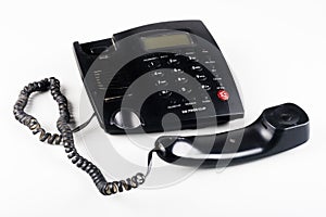 Closeup of an Off the hook black landline phone