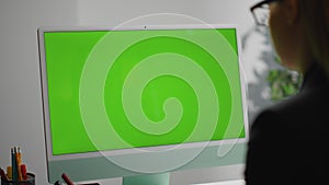 Closeup office green desktop computer. Freelancer surfing web checking report