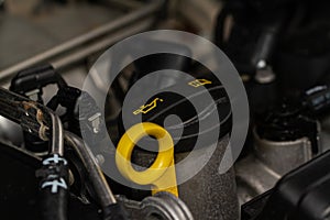 Closeup oil cap in engine room of a modern car. Oil cap on the car engine.