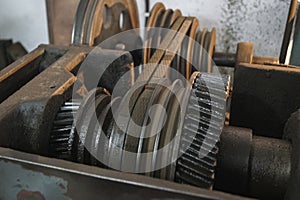 Closeup of oily metal gears and belt of old Lathe Machinery. Selective focus.