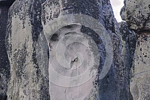 Closeup of an old big textured grey memorial rock megalith