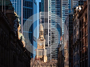 Closeup of an old building in the middle of tall business buildings in downtown Sydney