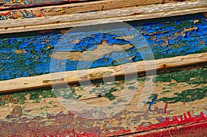 Closeup of an old colorful wooden boat hull