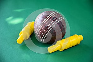 Leather cricket ball and wickets