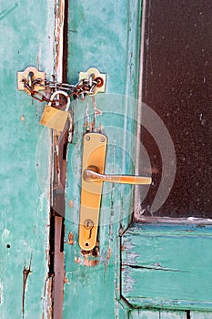 Closeup old door with lock / Vintage wooden door locked and security home,