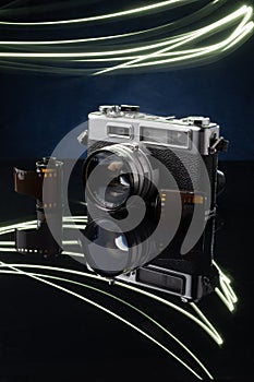 A closeup of an old film rangefinder camera