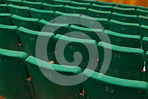 Closeup of old green seats