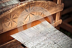 Closeup of an old hand-weaving vintage wooden loom