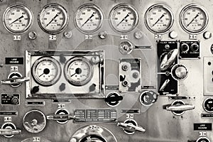 Closeup of an old instrument panel of a fire truck pump