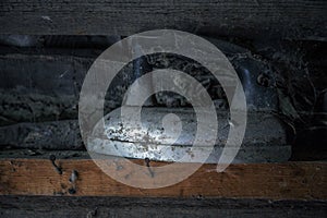 Closeup of an old iron with cobweb in house