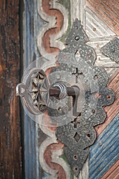 Closeup of old massive metal key in church ancient door