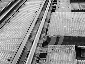 Closeup of an old railway track on steel bridge