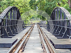 Closeup of an old railway track on steel bridge