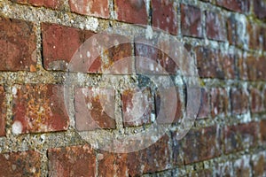 Closeup of an old red brick wall, copy space on a home exterior, house, or city building. Texture and detail background