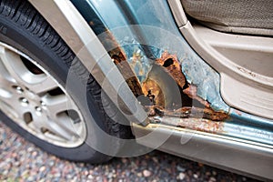 Closeup of an old rusty car wheel arch